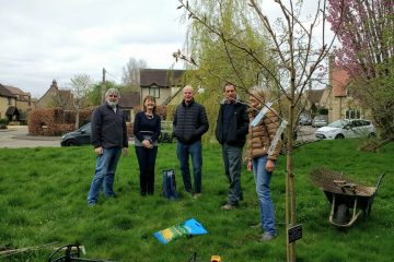 Volunteers planting a cherry tree by Fettiplace